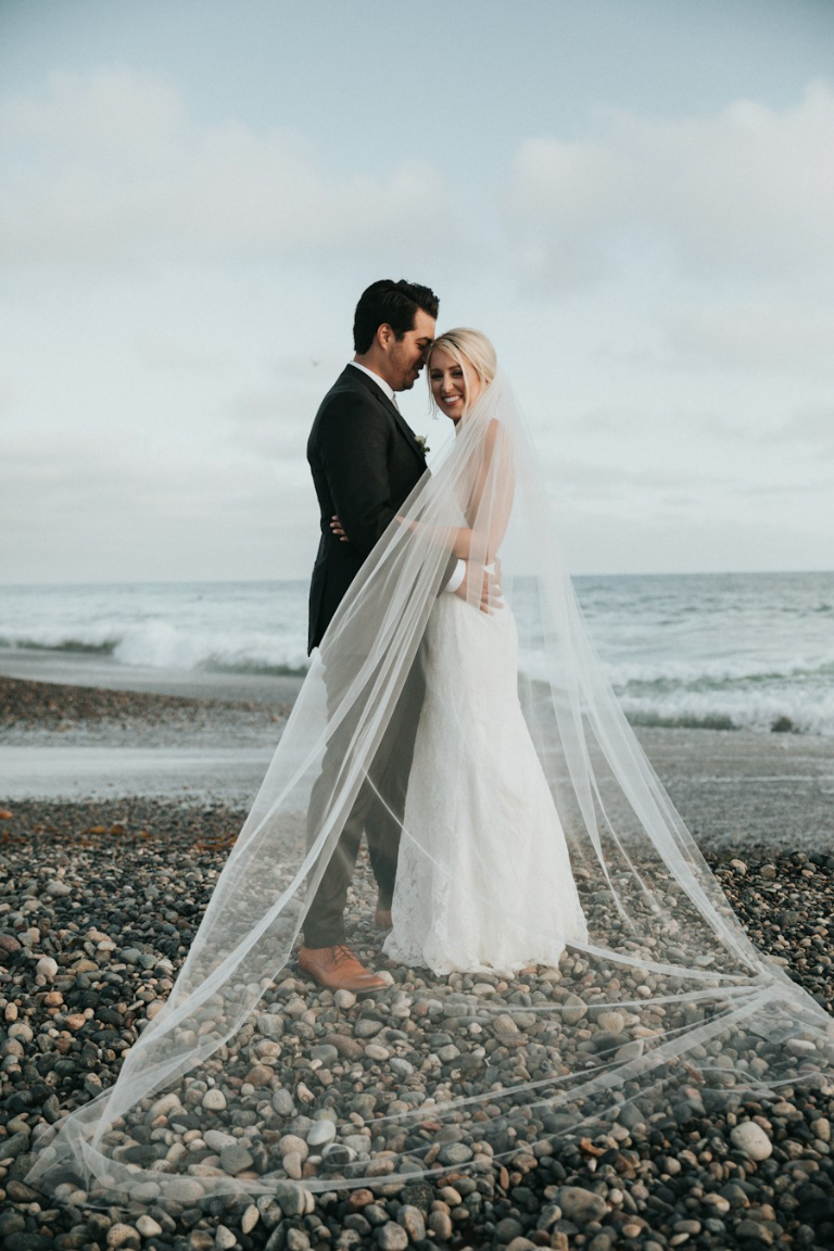 A couple celebrating their wedding outdoors